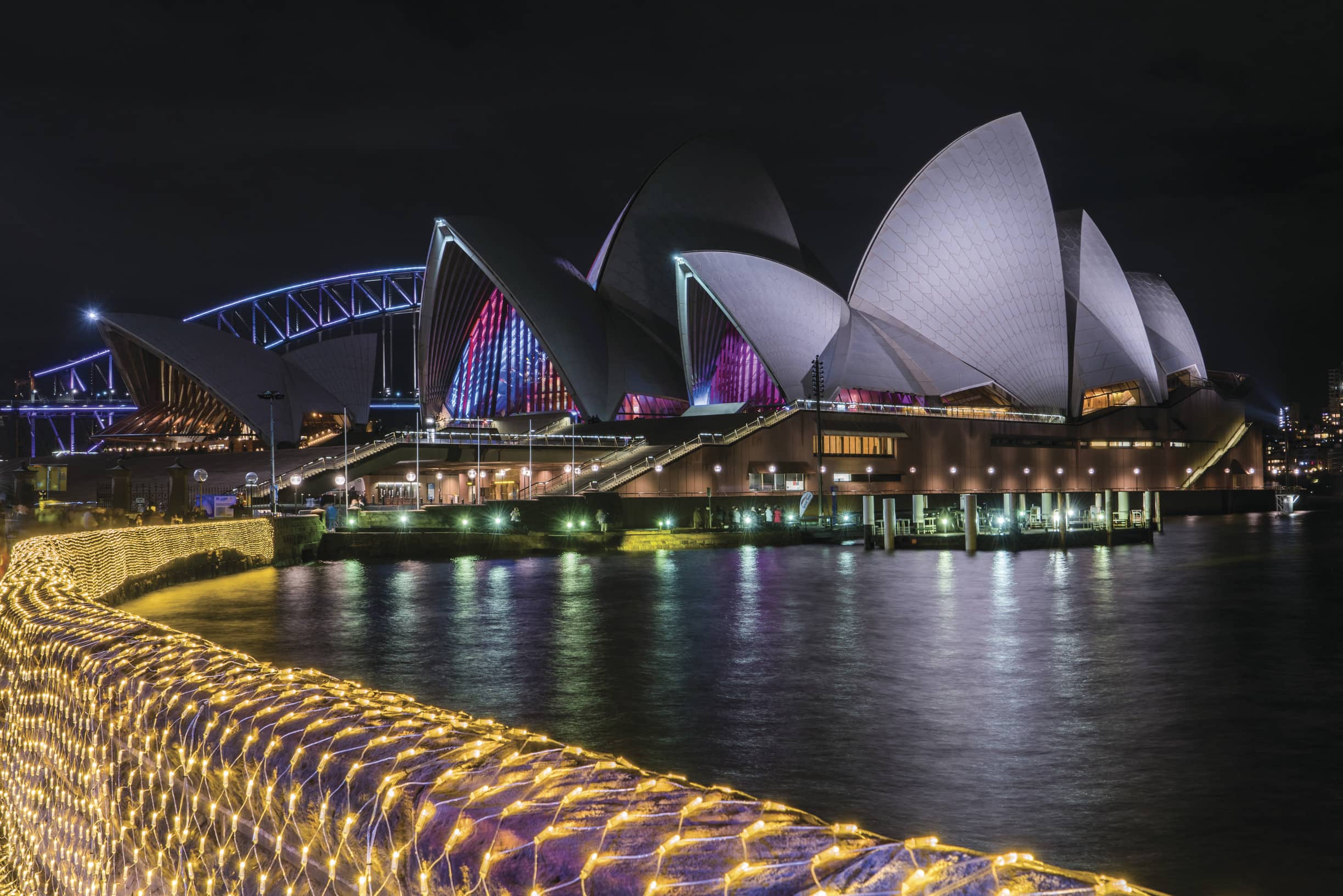 Sydney Opera House and the Sydney Harbour Bridge as viewed from The Royal Botanic Garden, Vivid Sydney 2016.